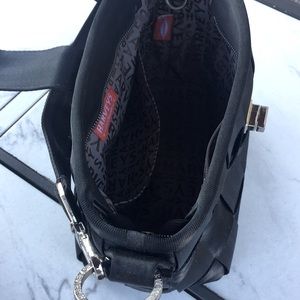 Black Harvey’s seatbelt purse, gently used